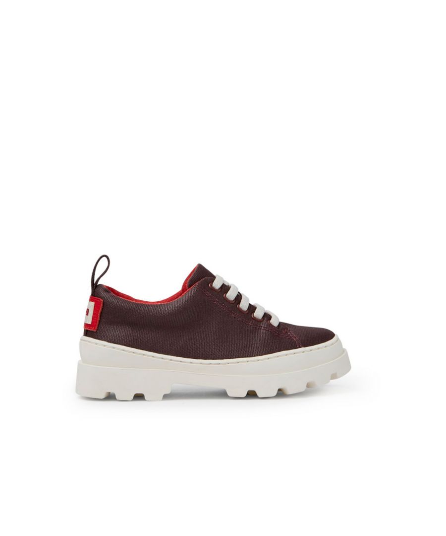 Burgundy organic cotton kids' shoes with recycled PET laces and 100% rubber outsoles.\n\nBrutus, with its robust urban design and exceptional grip, is durable enough for any kid thanks to its iconic shape and 360° stitching.