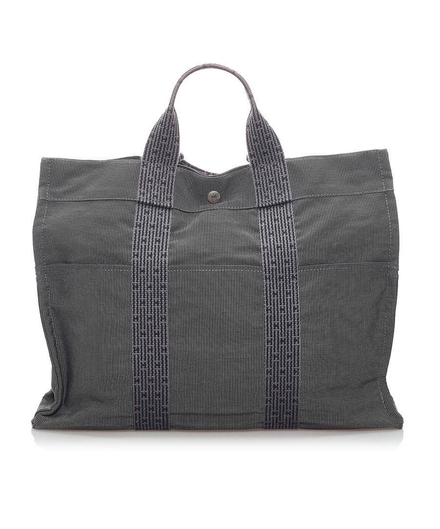VINTAGE. RRP AS NEW. The Fourre Tout MM tote features a canvas body, exterior front and back slip pockets, flat handles, an open top with a snap closure, and an interior zip compartment.Exterior back is out of shape and scratched. Exterior bottom is scratched. Exterior corners is scratched. Exterior front is out of shape and scratched. Exterior handle is discolored and scratched. Exterior side is scratched. Zipper is scratched and tarnished. Interior lining is scratched. Interior pocket is scratched and stained with others.\n\nDimensions:\nLength 32cm\nWidth 42cm\nDepth 11cm\nShoulder Drop 11cm\n\nOriginal Accessories: This item has no other original accessories.\n\nColor: Gray\nMaterial: Fabric x Canvas\nCountry of Origin: France\nBoutique Reference: SSU173059K1342\n\n\nProduct Rating: GoodCondition\n\nCertificate of Authenticity is available upon request with no extra fee required. Please contact our customer service team.