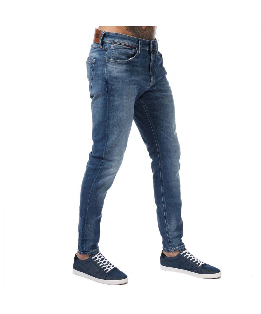 Mens Tommy Hilfiger Miles Skinny Fit Jeans in denim.- 5-pocket construction.- Zip fly and button fastening.- Fading at thighs  knees and back.- Tommy Hilfiger flag embroidery on back pocket.- Tommy Hilfiger branding.- Skinny fit.- 98% Cotton  2% Elastane.- Ref: DM0DM132141BK