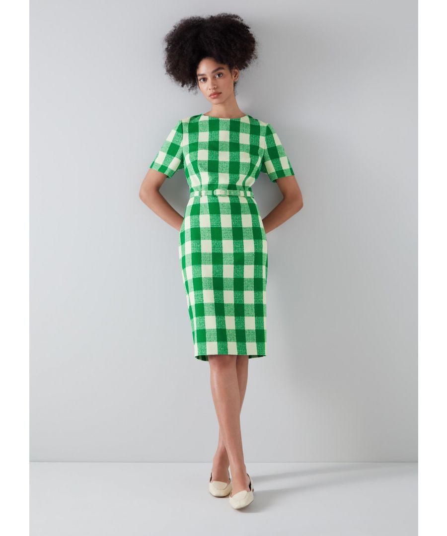 Taking on a 1960's Americana feel, our Maren dress is perfect for the spring months. Crafted from textured Portuguese fabric in a large green and cream gingham check, it has a round neck, short sleeves, a skinny buckle belt and a pencil skirt with a back slit. Wear it with chic flats to keep it casual or with chunky platforms to take it dressier.