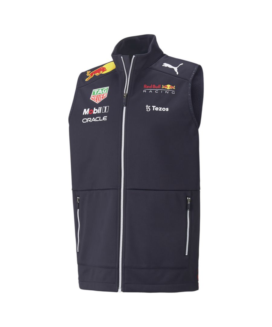 PRODUCT STORY Make a bold statement both on and off the race track in the Red Bull Racing Team Gilet featuring a bold Bull statue graphic emblazoned across the back. A must-have for colder racing days, the brushed fleece backing keeps you snug whatever the weather, while iconic branding leaves no doubt whose team you're on. DETAILS Regular fitFull-zip closureSide zip pocketsPrinted Bull graphic on backPrinted Red Bull Racing logoPrinted team partner logosPrinted PUMA Cat Logo