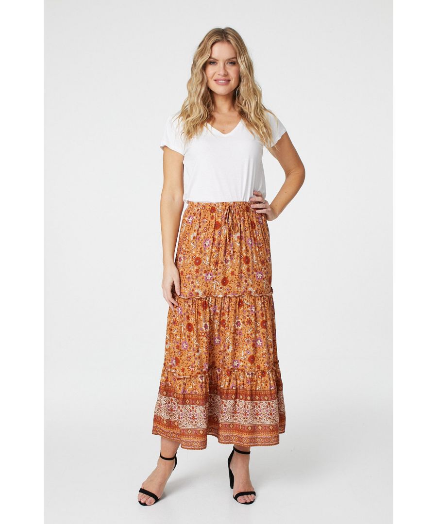 Add a statement vintage floral maxi skirt to your closet. With a elasticated waist, a tie front, a tiered a-line skirt, a bold border print hem and a full length skirt. Pair with a t-shirt and sandals for a chic holiday outfit or dress up with a silk cami top and heels.