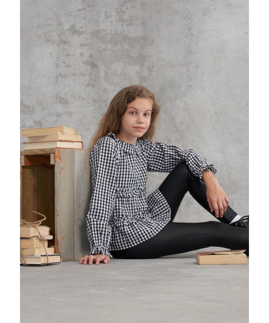 This gingham tiered blouse is the perfect addition to any wardrobe. Super soft brushed cotton with ruffle details and cute collar would pair with a skirt  jeggings or Mom jeans. Check Mate  Angel & Rocket cares: made with fairtrade cotton .  Colour: Black  About me: made with 100% cotton   Look after me – Think planet  wash at 30c