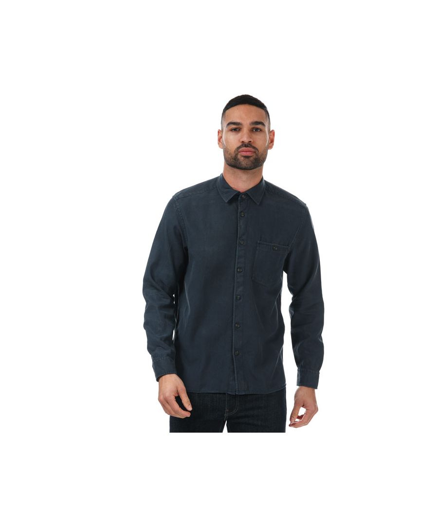 Mens Ted Baker Brewin Relaxed Overshirt in navy.- Pointed collar.- Long sleeves with button cuffs.- Full button closure.- Button top pocket.- Relaxed fit.- 68% Lyocell  32% Cotton. Machine washable.- Ref: 253363NAVY