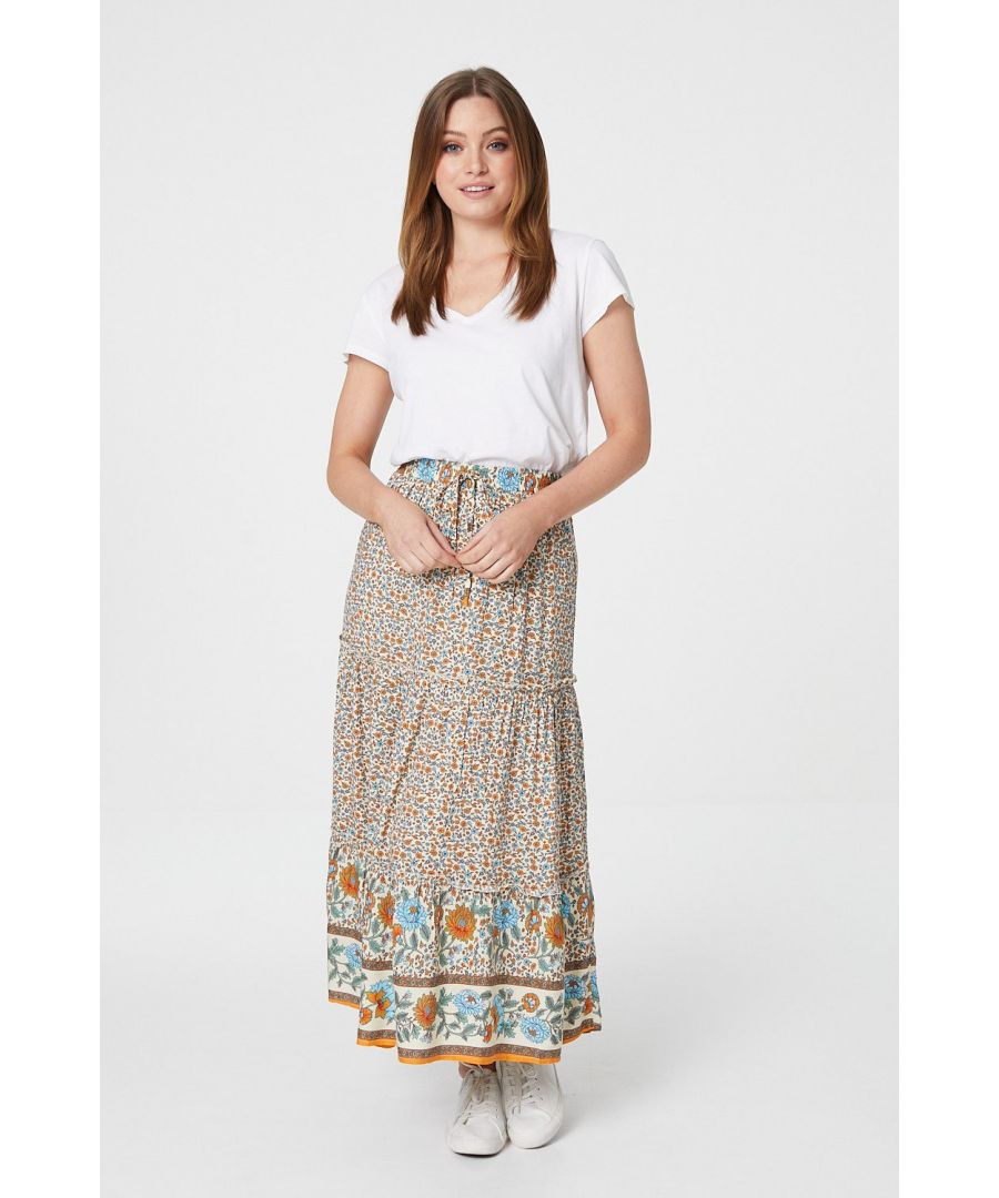 Every wardrobe needs a flattering maxi skirt like this floral maxi skirt. With a high waist, a tie detail front, a tiered full length skirt and a contrasting border print panel. Pair a white t-shirt and nude espadrille heels for an elevated daytime outfit.