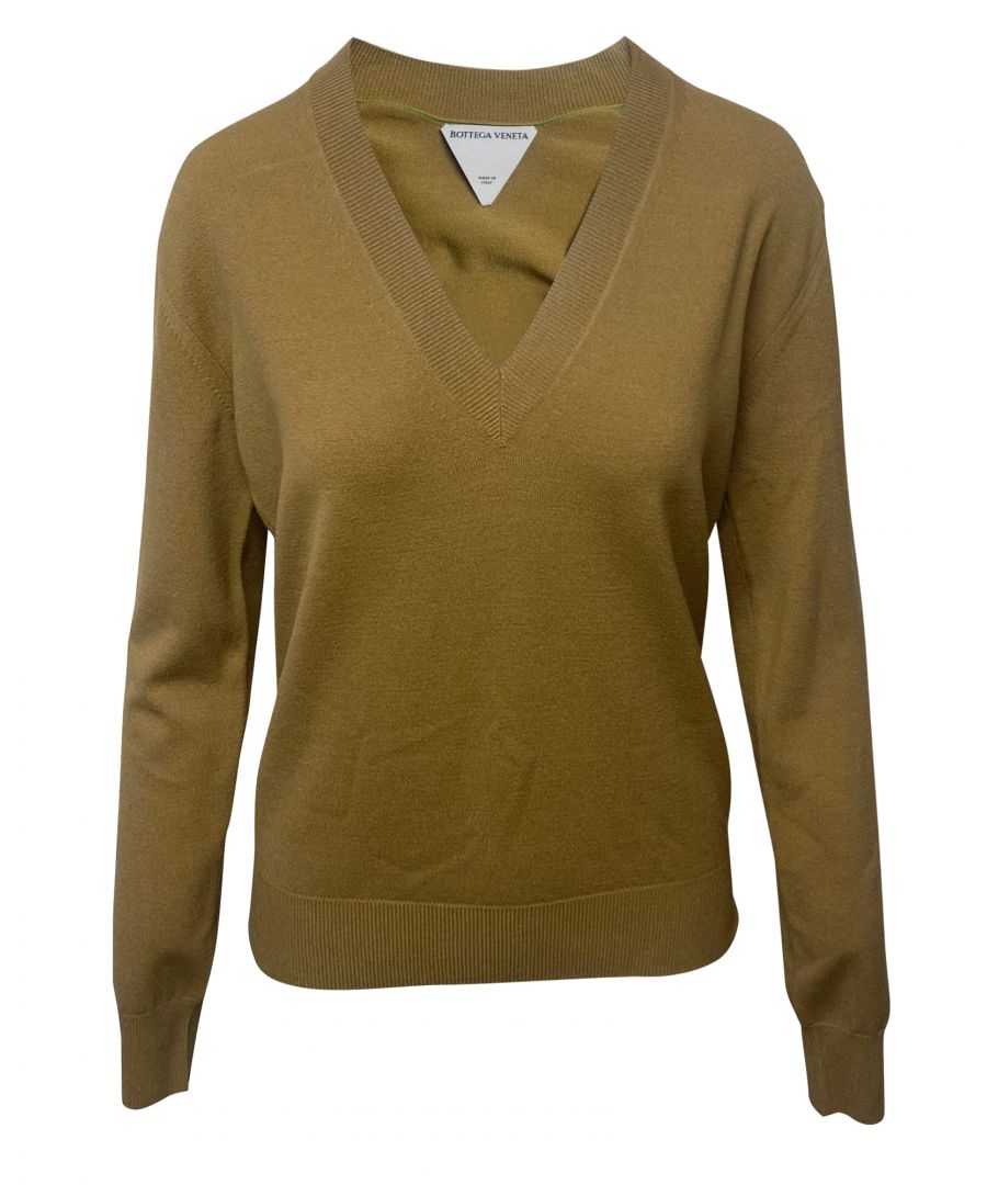 VINTAGE. RRP AS NEW. Woven from soft wool-blend yarns in a rich dark-brown shade that is Bottega Veneta's signature, this sweater has a chunky ribbed V-neck. Style yours with jewelry stacked over the cuffs.\n\nBottega Veneta V Neck Sweater in Brown Wool\nColor: brown\nMaterial: Wool/Hair | Lana vergine\nCondition: excellent\nSize: XL\nSign of wear: No\nSKU: 86060   \nDimensions:  Length: 600 mm