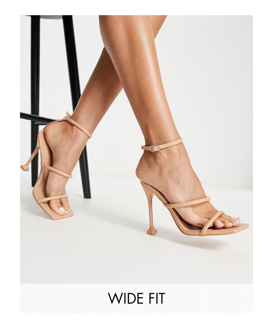Heels by Public Desire Level up Pin-buckle ankle fastening Double straps Open toe High flared heel Wide fit Sold by Asos