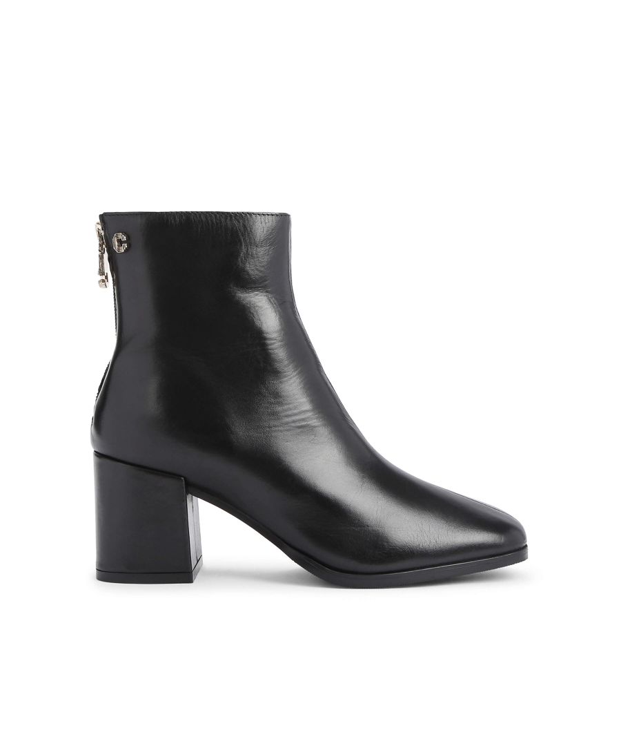 The Soothe Ankle Boot features a black leather upper. There is a golden metal Icon C pull tab on the zip. Heel height: 60mm. This style features ‘All Day Long’ technology. Material: Leather.