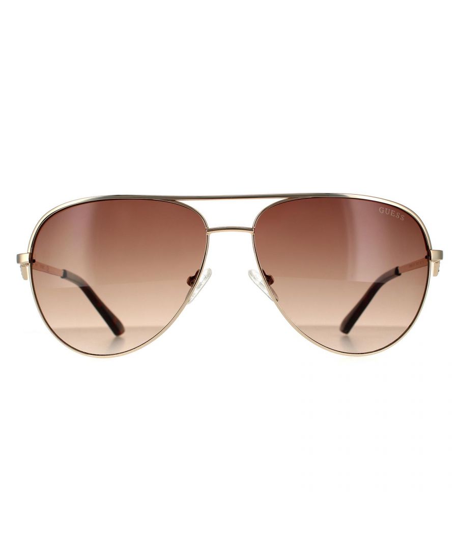 Guess Aviator Unisex Gold Brown Gradient Sunglasses GF6098 are a aviator design crafted from lightweight metal. A double bridge design, adjustable nose pads and plastic temple tips provide an all round comfortable fit. The hinges feature an embellished version of Guess's emblem for brand recognition.