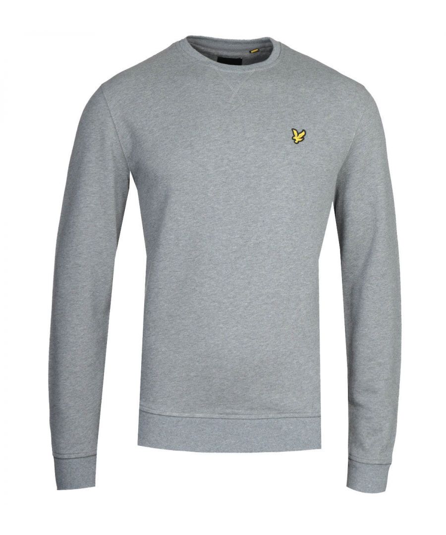Mens Lyle and Scott Crew Neck Sweatshirt in grey.- Ribbed crew neckline featuring a ribbed V panel.- Long sleeves.- Ribbed cuffs & waistband.- Lyle & Scott golden eagle embroidered to the left of the chest.- Regular fit.- 100% Cotton.  Machine wash at 30 degrees.-  Ref: ML424VTRT28