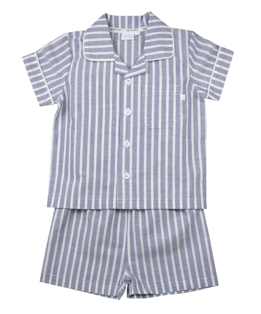 Blue and White Stripe Traditional Shortie Pyjamas.\n\nOur classic short sleeve crisp summer cotton boys pyjamas in a blue and white stripe creates a traditional look that’s perfect for lounging or sleeping. Made from super-soft 100% crisp cotton. The set is trimmed with white cotton piping. The top has an open collar and revere, single square pocket with MV tab and fastens with Mini Vanilla Engraved buttons. The crisp cotton comfy shorts have a fully soft elasticated waist for extra comfort. \n\nSold as a Pyjama set.\nFabric 100% cotton - crisp summer weight.\nFire Warning : KEEP AWAY FROM FIRE AND FLAMES.\nWash Care Instructions : Machine wash inside out, do not soak, wash dark                    colours separately, do not iron trims. Save energy and wash at 30 degrees.\nDo not tumble dry