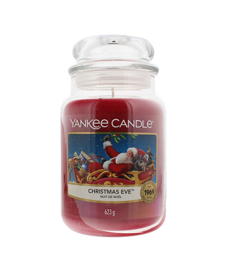 The Yankee Christmas Eve Candle contains top notes of Orange, Almond, Lime and Lemon; middle notes of Red Berry, Cinnamon and Nutmeg; and base notes of Violet Amber, Creamy Praline and Vanilla. Those notes combine to create a traditional Christmassy scent, full of sweet and spicy notes. The notes make for a clean, fresh and luxurious scent. The candle is made from premium grade paraffin wax which delivers a clean, consistent burn and has a burn time of between 110 and 150 hours.