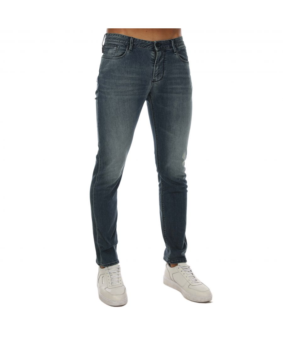 Mens Armani J06 Slim Fit Jeans in denim.- 5-pocket construction. - Zip fly and button fastening.- Seven belt loops on low waist band.- Metal eagle at rear waist.- Logo leather tab at coin pocket.- Slim fit.- 97% Cotton  3% Elastane.- Ref: 6G1J06D19Z0943