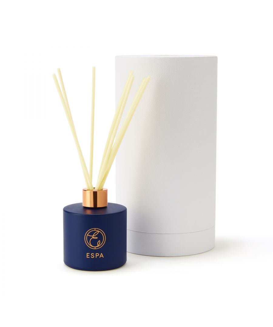 A warming fireplace with sparkling embers and velvety petals, brought to life by ESPA's Frankincense and Myrrh reed diffuser.  \n\nRelax as Cedar Wood, Rose and Orris come together for a soothing melange of warm woods to join you on your wellbeing journey from day to night. \n\nESPA's Frankincense and Myrrh Reed diffuser is hand-poured and equipped with snow-white natural reeds, bringing elegant luxury to your home. Housing rich essential oils, the heavenly aroma evenly disperses throughout the day. Exhale into a comforting environment for the mind, body and spirit.  \n\nIn a limited edition scent and midnight blue colourway, this diffuser comes in ESPA's classic 200ml to fully scent your surroundings, helping you to reset and rebalance.