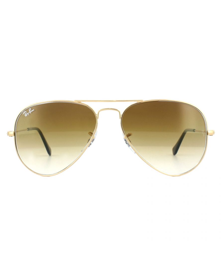 Ray-Ban Sunglasses Aviator 3025 001/51 Gold Brown Fade were originally designed in 1936 for US military pilots and have since become one of the most iconic sunglasses models in the world. The timeless design is characterised by the thin metal wire frame, large teardrop shaped lenses and fine metal temples that feature silicone tips and nose pads for a customised and comfortable fit. This classic model is available in various sizes and an array of colourways.