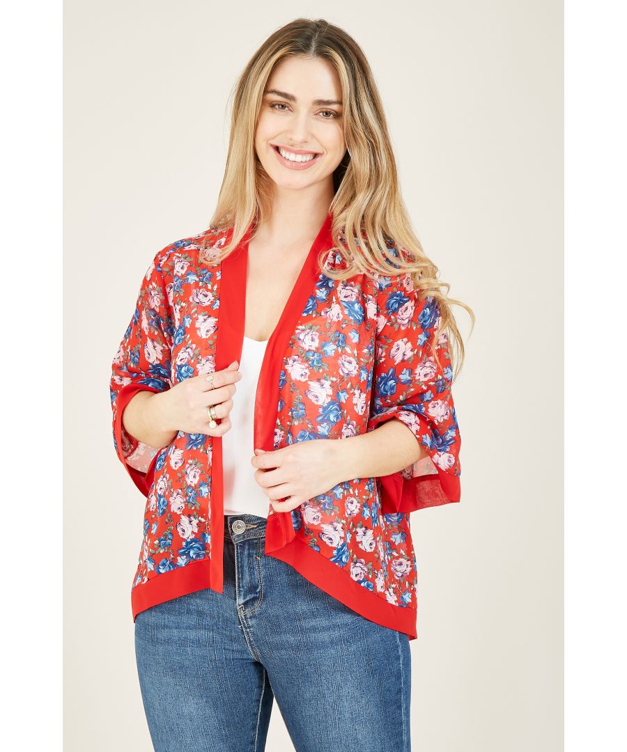 Mix it up and layer this Mela Rose Printed Short Kimono over any block coloured fit this summer. Crafted to be super lightweight and breathable, this short kimono features a feminine blue and baby pink floral rose pattern, set upon a strking block red, with a corresponding trim. Pair with red heels, jeans and a clutch and hit the town, or throw over a bikini and soak up some sun.  100% Polyester Machine Wash At 30