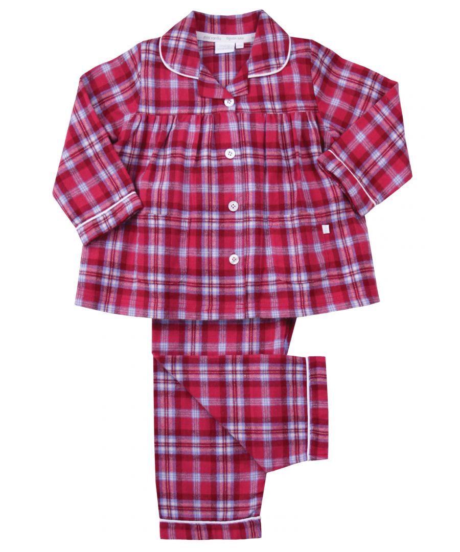 Pretty in Raspberry Pink Girls Check Traditional Pyjama Set. \n\nA timeless check is given the Mini Vanilla touch using raspberry pink, lilac and red tones in our kids pyjama set. Made from super-soft and cosy, brushed 100% cotton, the PJ set is trimmed in white cotton. The long-sleeved top has an open collar and fastens with engraved buttons. Fully elasticated at the waist the trousers have a comfy fit.\n\nOur pure-cotton check pyjamas are a beautiful-quality addition to their nightwear collection. Our cotton flannel is brushed, making it unbeatably soft and cosy against the skin and plush to the touch. A great nightwear gift for girls too!\n\nFeatures\nButton-through long-sleeved top\nClassic Brushed Check\nNeat piping along collar and cuffs\nElasticated waistband\n100% soft brushed Cotton\nMachine Washable\nFront pockets\nEngraved pearl effect buttons