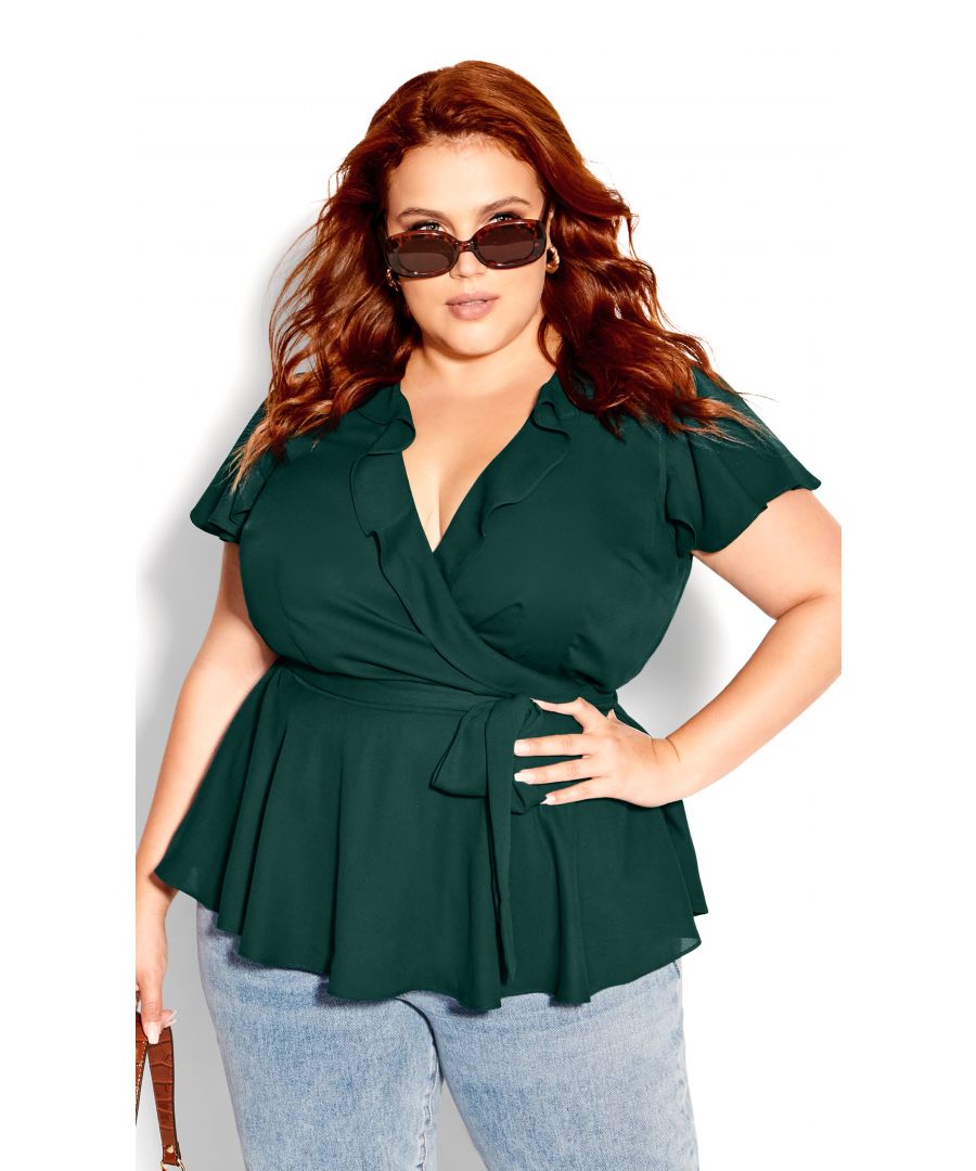 Flaunt your curves in our dreamy Wrap Frills Top! This faux wrap top is belted at the waist and finished with flutter sleeves for a feminine twist. The peplum silhouette and ruffle details are guaranteed to turn heads. Key Features Include: - Faux wrap ruffled V-neckline - Short flutter sleeves - Elasticated back waistband - Removable self tie belt - Peplum silhouette - Relaxed hemline - Unlined Try wearing this top with leather pants and sparkly heels for a sleek night out!