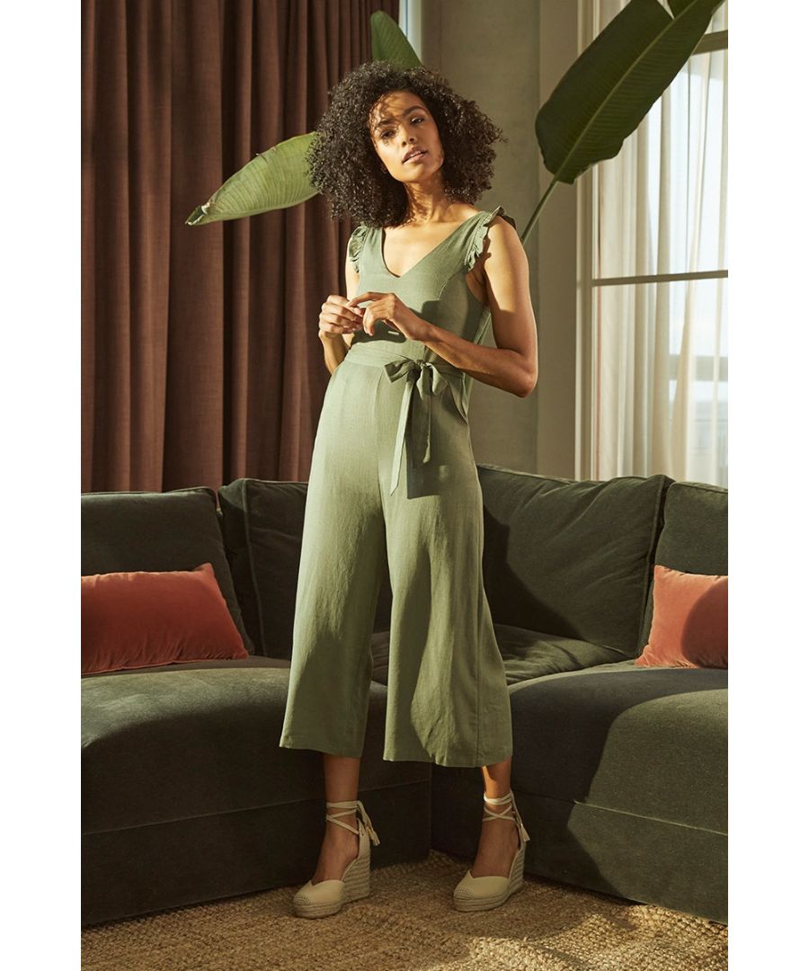 Add a versatile wide leg jumpsuit to your new season closet. With a v-neck, wide cami straps with a frilled trim and an adjustable length option at the back, a removable tie belt, pockets and wide cropped legs. Pair with trainers for the perfect off-duty look or with nude espadrille heels for an elevated daytime outfit.