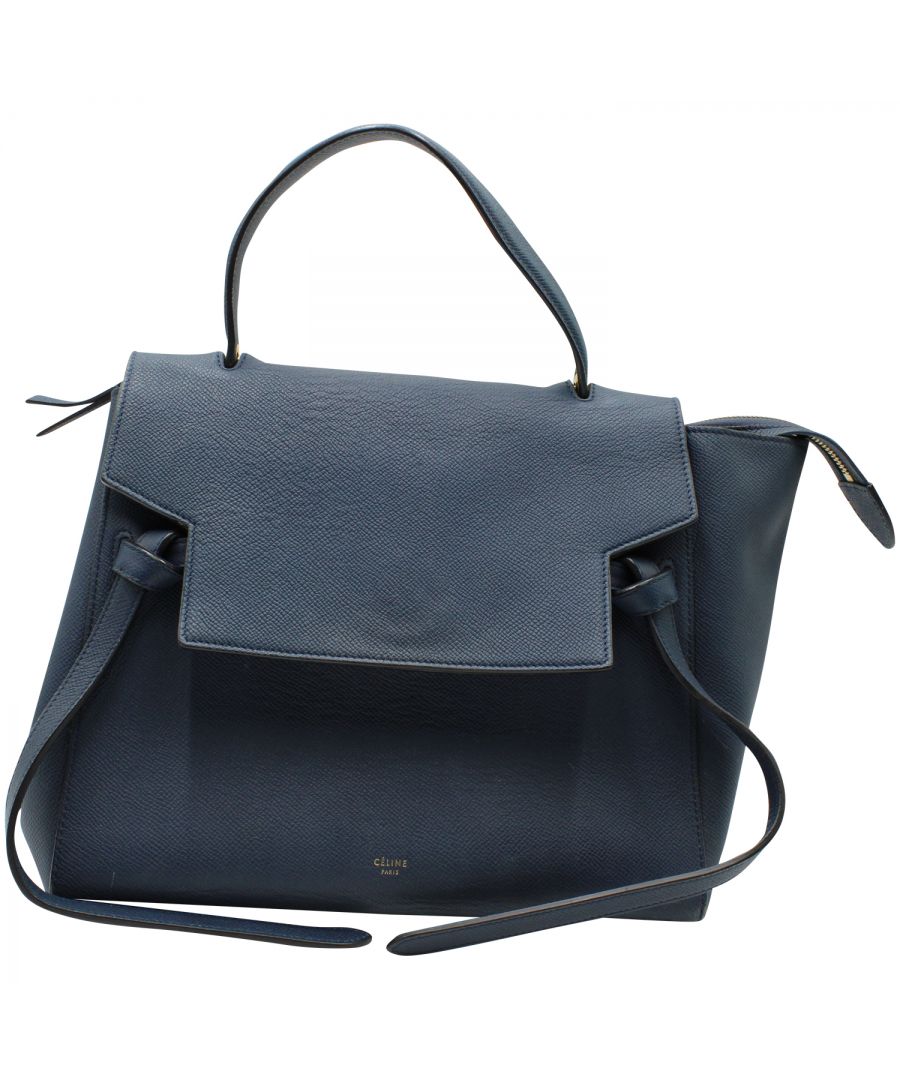 VINTAGE, RRP AS NEW\nThis chic tote by Celine is crafted of richly grained calfskin leather in blue. The bag features a leather top handle and an optional, adjustable shoulder strap with polished brass hardware. The facing flap opens to reveal a top zipper and a matching blue suede leather interior.  Carrying this bag will fit a lot of your items with out sacrificing style.  \n\nCeline Belt Top Handle Bag in Blue Leather\nCondition: Good\nSign of wear: Multiple scratches on the hardware and bottom part on the leather. Moderate signs of wear in the handles and interior lining.\nMaterial: Leather\nColor: blue\nSize: One Size\nDimensions:  Length: 310 mm, Width: 170 mm, Height: 220 mm\nStrap Length: 780 mm\nSKU: 138688 / NAPBKGBBA118983W