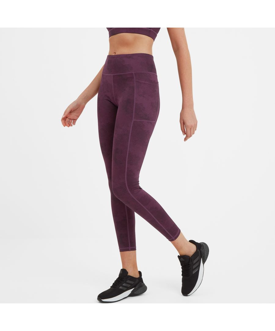 Seriously stretchy, super-soft and packed with features for added comfort and support, our Ellyre leggings are just the job for yoga, pilates or your morning exercise. These opaque leggings have a stretchy, deep waistband for added support where you need it and anti-chafe seams for comfort. There is a zip pocket at the back for your key and cash and a large, but discreet, pocket on the thigh seam to store your mobile phone. Designed by our team in West Yorkshire, Ellyre comes in an all-over printed pattern in a colour inspired by moorland heather and has discreet reflective strips at the back that stand out against car headlights when it's dark, making you more visible if you are out for an early morning or late night run. This finishing touch is a reflective Yorkshire Rose print at the bottom of one leg.