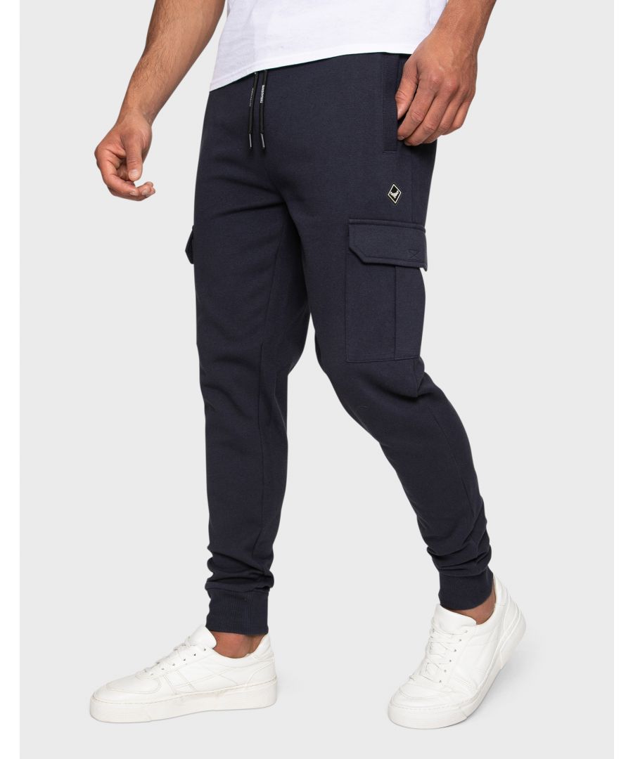 These regular fit, cargo style joggers from Threadbare have a ribbed elasticated waist band with a drawstring and feature side pockets, cargo pockets and have elasticated cuffs. Made in a cotton blend fabric to ensure a really comfortable feel. Other colours available.