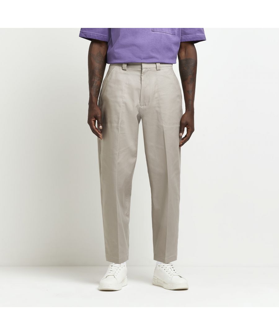 > Brand: River Island> Department: Men> Colour: Stone> Type: Trousers> Style: Chino> Size Type: Regular> Fit: Relaxed> Material Composition: 98% Cotton 2% Elastane> Occasion: Casual> Pattern: No Pattern> Material: Cotton Blend> Season: AW22