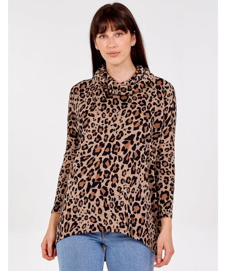 Go oversized this winter with this leopard print top. The hi low shape of this garment compliments any figure shape as it is long and flowing. Works great with jeans and sneakers or dressed up with black heels!\nConstruction: 95% Polyester, 5% Elastane. Machine Washable. Approx. Length: 77cm.