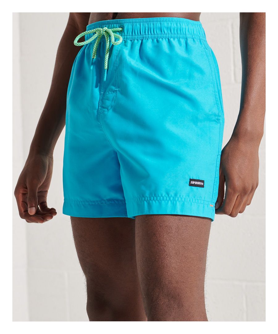 Rock the beach or pool this season with the Water Volley Swim Shorts, featuring an elasticated drawstring waist, and three pockets.Elasticated waistbandDrawstring fasteningThree pocketsMesh liningSignature logo patchPlease note due to hygiene reasons, we are unable to offer an exchange or refund on swimwear, unless they are sealed in their original packaging. This does not affect your statutory rights.