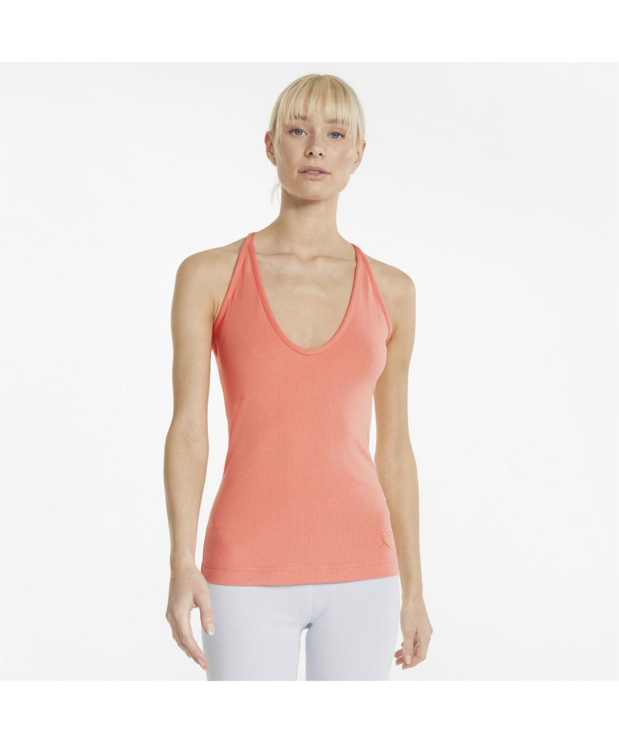 The perfect layering piece for workouts of every kind, from the gym to the track to the yoga studio. The stylish racerback design and deep V-neck maximise your freedom of movement during training, and the soft ribbed material makes for a snug, comfy fit. This piece from our elegant Exhale collection is made with recycled materials as a step towards better sustainability. FEATURES & BENEFITS Recycled Content: Made with at least 20% recycled material as a step toward a better future  DETAILS V-neckSleeveless cutEmbroidered shiny mirrored PUMA Cat Logo at bottom leftModal, recycled polyester and elastane