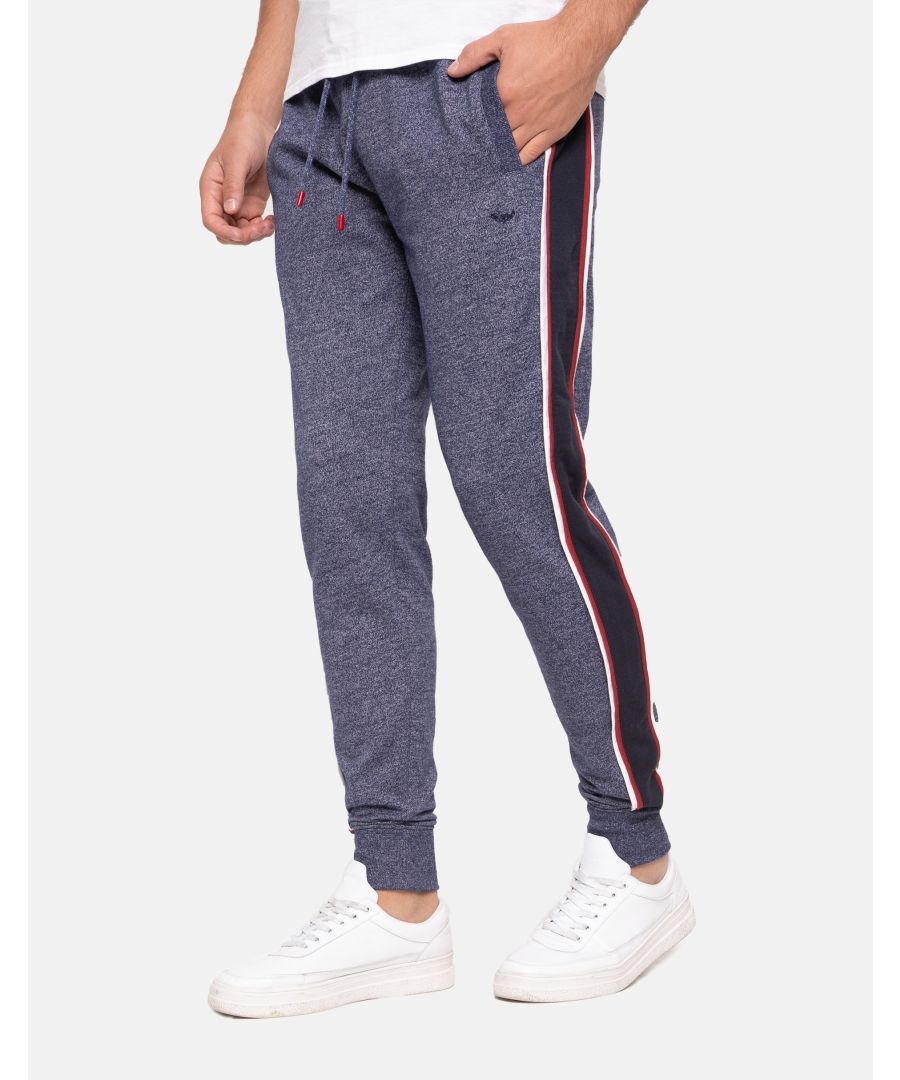 These sporty style joggers from Threadbare have a ribbed elasticated waist band with a drawstring, elasticated cuffs, side pockets and stripe detail down the legs. Made in a cotton blend fabric to ensure a really comfortable feel. Other colours available.
