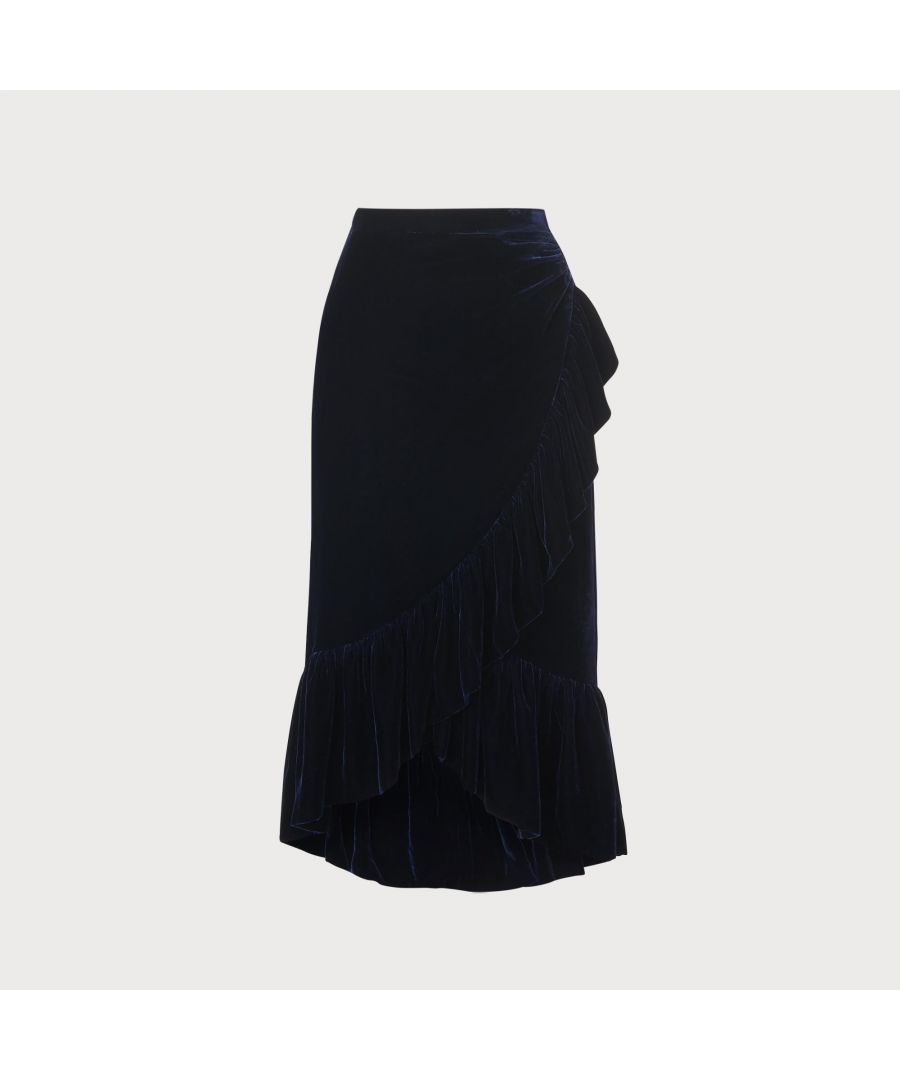 The perfect skirt for party season, 1930s-inspired Freud works by day or by night. Crafted from rich and luxurious velvet in beautiful midnight blue, it has a crossover ruffle hem with ruching detail on the hip and a midi length. Wear it with a blouse and boots or with a camisole and courts and enjoy its playful ruffles on the dancefloor.