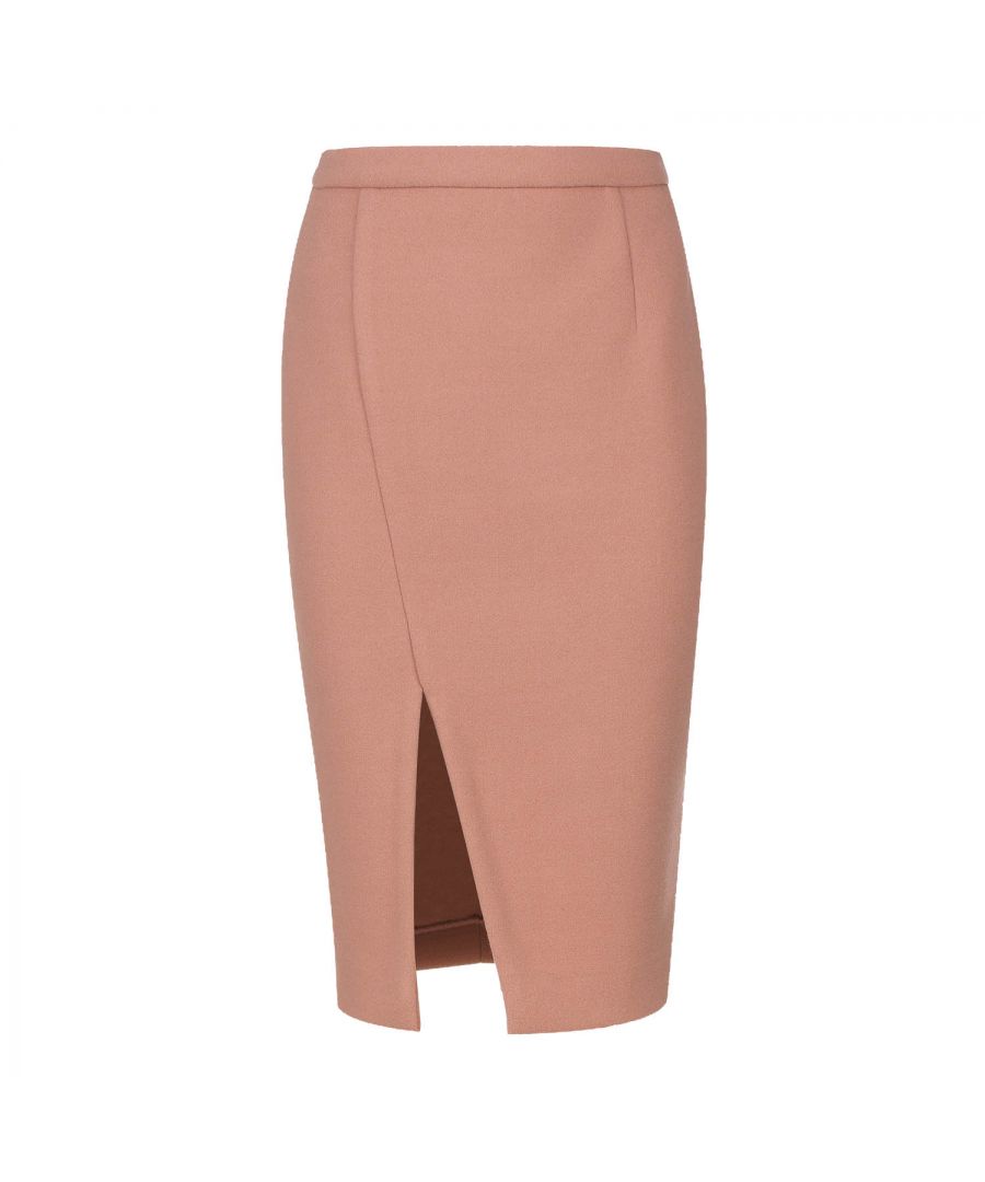 This salmon colour winter pencil skirt is crafted in faux mouflon style coat fabric. It has a 4cm wide waistband in the same fabric with darts below in the back. There is an off-centre slit in the front. It fastens in the back with a concealed zip. This pencil skirt is knee length and fully lined. Wear with a fitted jersey top or, for a more formal office look, with a blouse and jacket. Heels and an off-shoulder top will take this skirt and you for a night on the town!