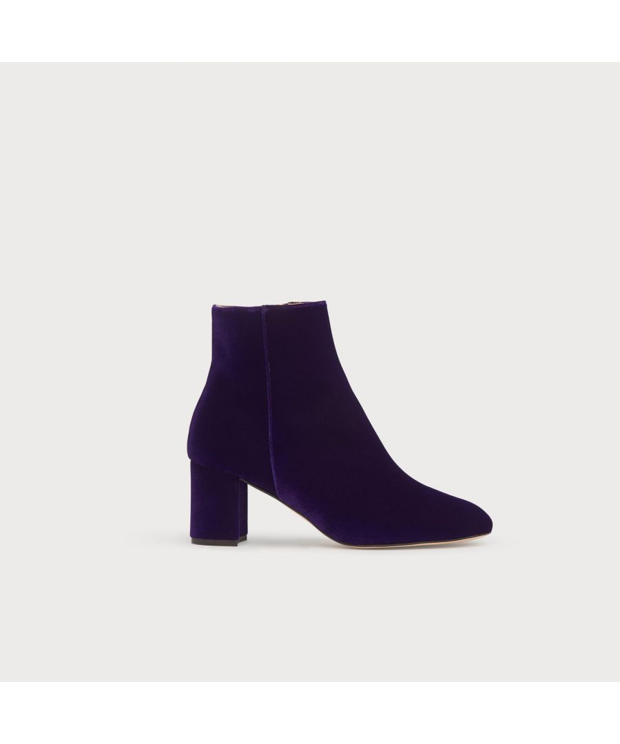 Playing to our love for texture and animal prints this autumn, our Jette boots in violet velvet are the perfect everyday style - with a playful side. Expertly-crafted in Spain, this minimalist design has a sleek shape with a squared-off toe and a manageable block heel. Versatile enough to wear with tailored looks or your favourite autumn skirts and dresses, they add a new dimension to your look thanks to their tactile fabric.