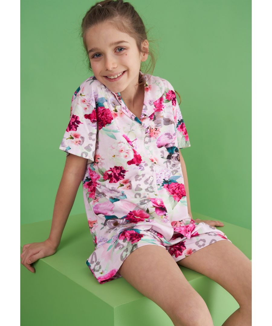   Perfect for summer nights and sleepovers  this pyjama set is made with a supersoft cotton jersey. With an all-over beautiful bloom print the button-through top matches perfectly with comfortable elasticated waist shorts.   Angel & Rocket cares - made with Fairtrade cotton   Colour: Pink   100% cotton   Look after me: Think planet  wash at 30c