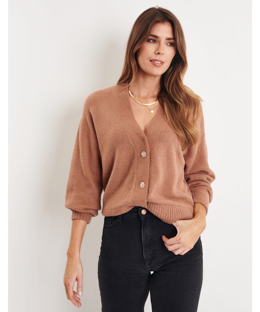 Stay cute, cosy and stylish with this button down cardigan from Threadbare. This cardigan features jeweled buttons,  ribbed hem and sleeve cuff. A versatile piece perfect for dressing up or down. Other colours and styles are available.