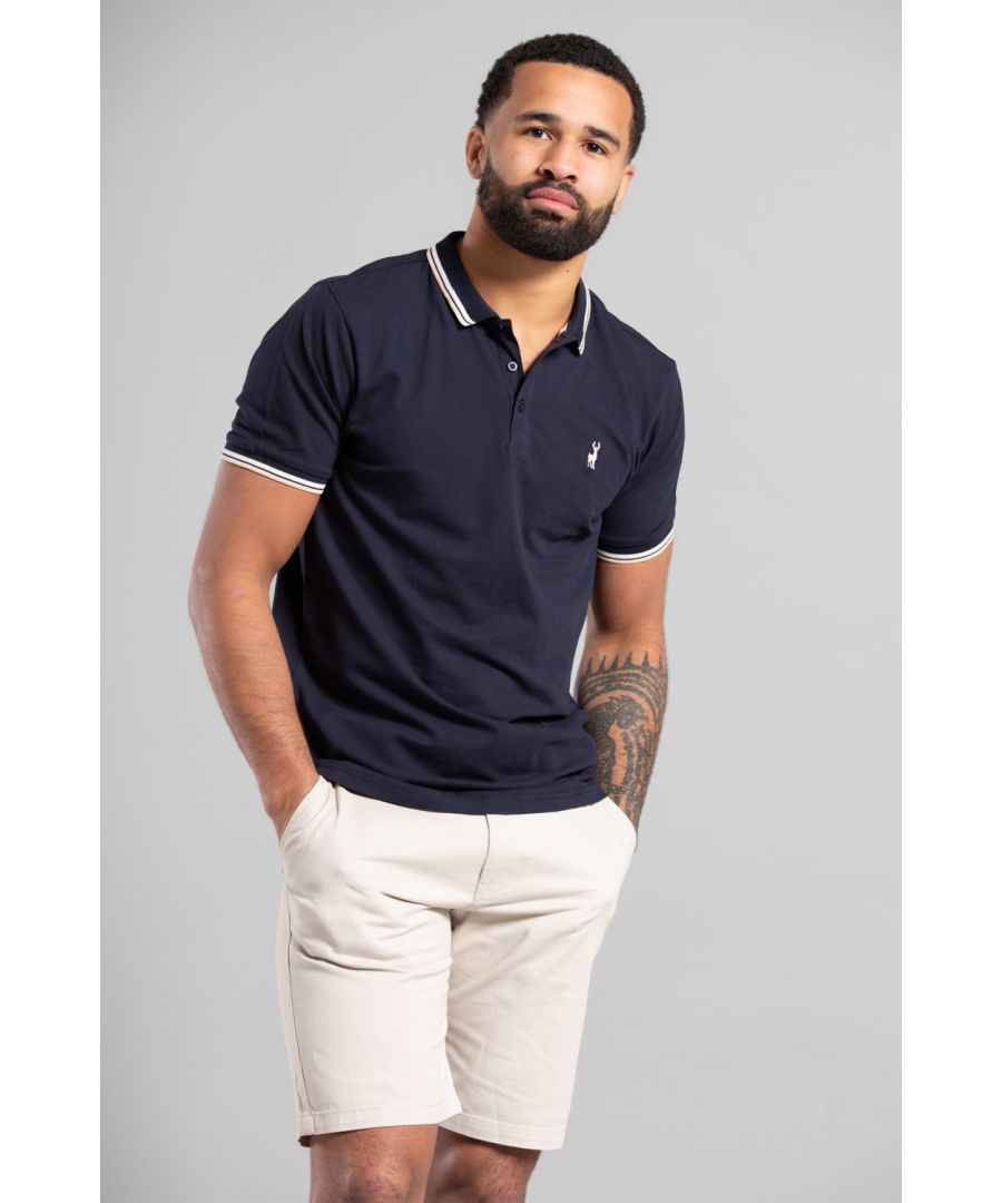 Get a timeless look with Kensington Eastside's classic polo shirt. Made from 100% cotton in a pique knit, it's both comfortable and stylish. Featuring an embroidered logo on the chest, and contrast detail collar this shirt is perfect for casual outings. Shop now and elevate your wardrobe with this versatile piece. This polo is machine washable and easy to care for!