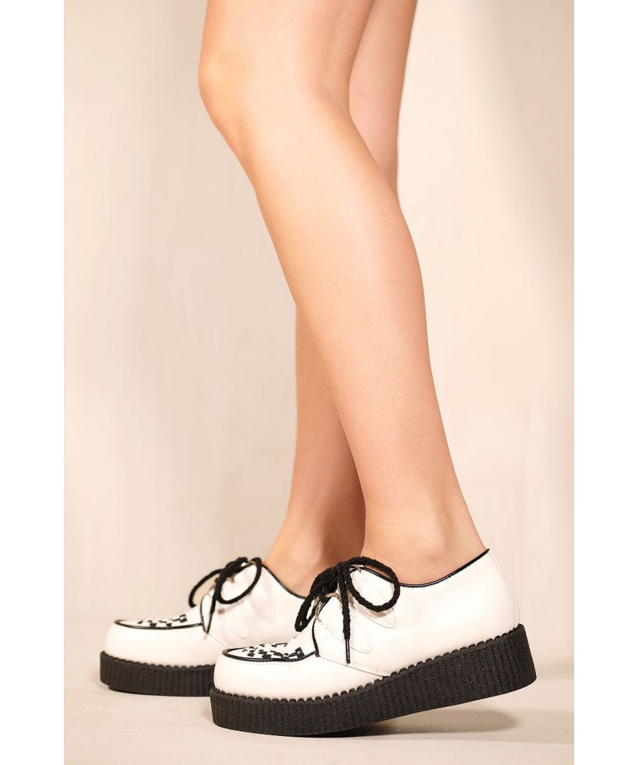 A chic and versatile pair of shoes will take you from the office to a night on the town. Remain a mystery in these platform creepers that have a vegan PU construction and adjustable lace-ups.  A unique style that draws the eye due to its subtle yet distinctive design!