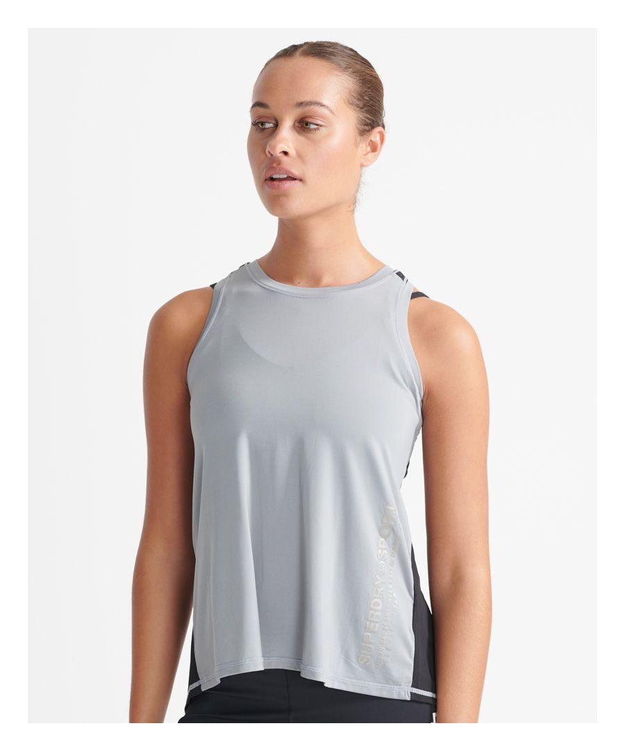 Superdry women's cooling loose vets top. This super lite racer back vest top features a complete mesh back with a split back to allow extra heat to escape. Finished with Superdry Sport branding to the front.