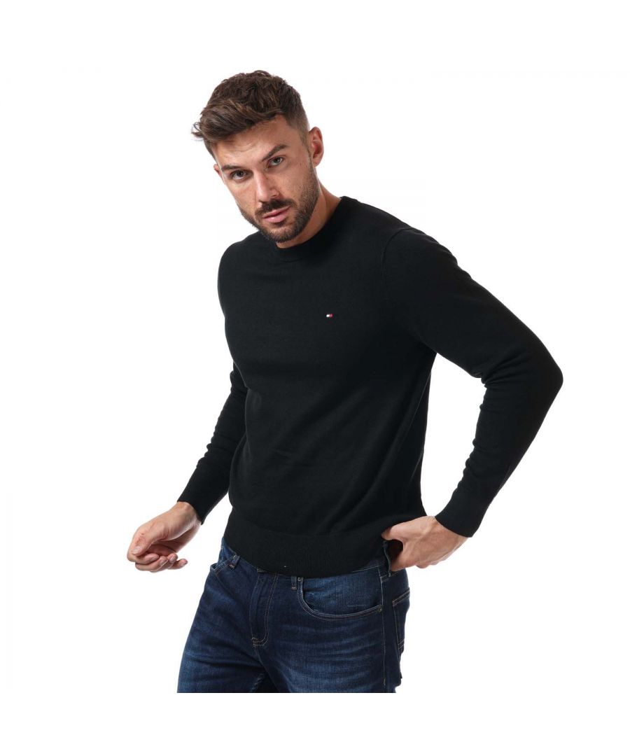 Mens Tommy Hilfiger Pima Cotton Jumper in black.- Ribbed crew neck.- Long sleeves.- Ribbed hem.- Brands famous flag embroidered to the chest.- Regular fit.- 92% Cotton  8% Cashmere.- Ref: MW0MW11674BDS