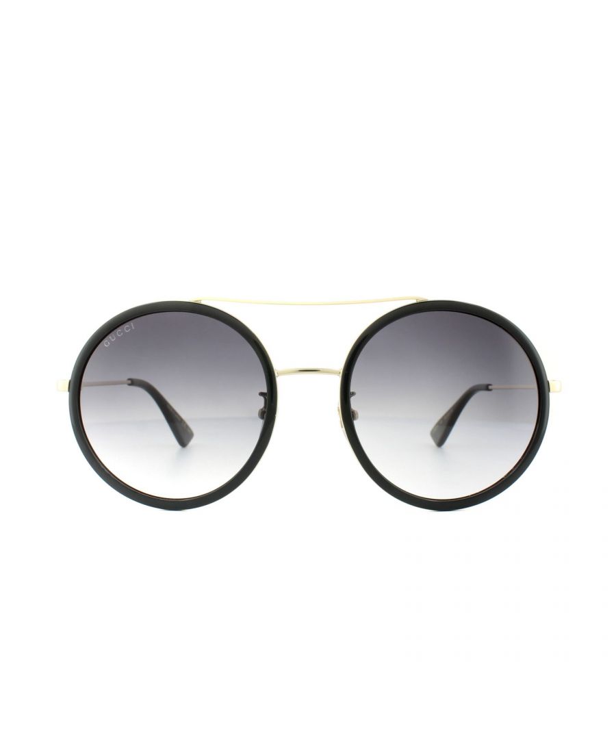 Gucci Sunglasses GG0061S 001 Black Gold Grey Gradient have a super lightweight thin metal frame with double bridge joining the round shaped lenses in a very fashionable modern style. Interlocking GG logo appears along the temples and Gucci logo on the right lens.