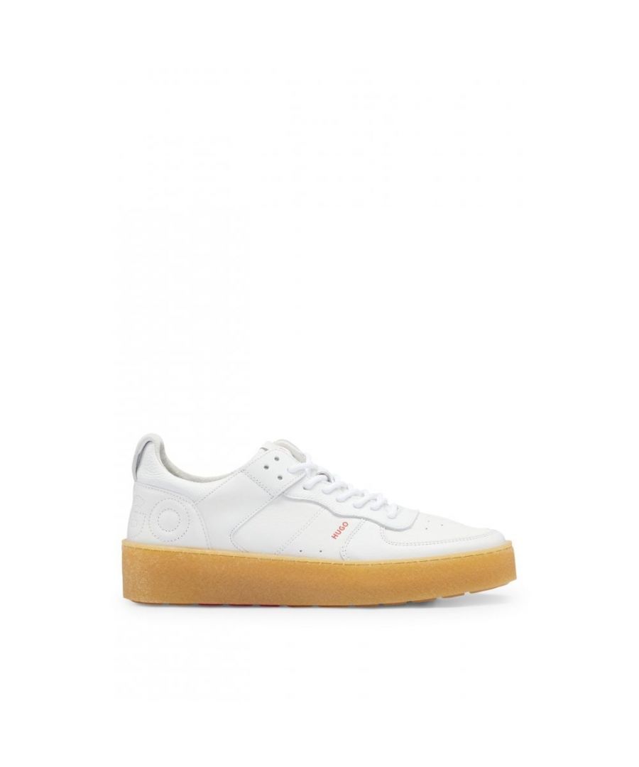Low-top trainers by HUGO, shaped in nappa leather with a lace-up closure and a tonally stitched logo on the backtab. By purchasing this product, you are supporting responsible leather manufacturing through the Leather Working Group (LWG). We only use skins and hides which are by-products of the food industry.\nLacesFully linedPackaging: Box\nUpper material: 100% Cow skin, 50% Polyurethane, 50% Polyamid, Sole: 100% Rubber, Innersole: 50% Polyurethane, 50% Polyamide\n50493175\n 
