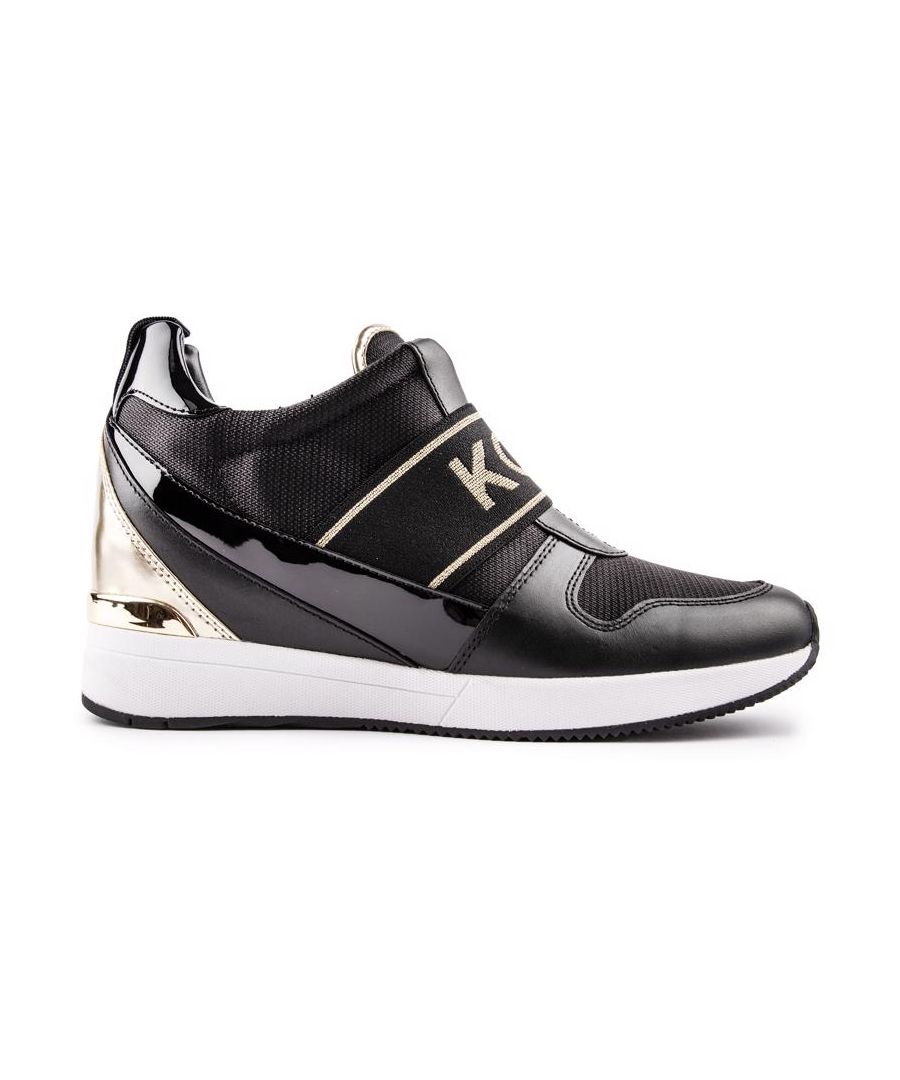 This Michael Kors Maven Wedge Trainer Is The Ultimate In Stylish Comfort With That Extra Height. Featuring A Black Premium Upper With An Eye-catching Design And Golden And Shiny Patent Details. These Designer Shoes Have A Branded, Elasticated Band A And Hidden Wedge Sole For A Stand Out Smart-casual Fashion Look.