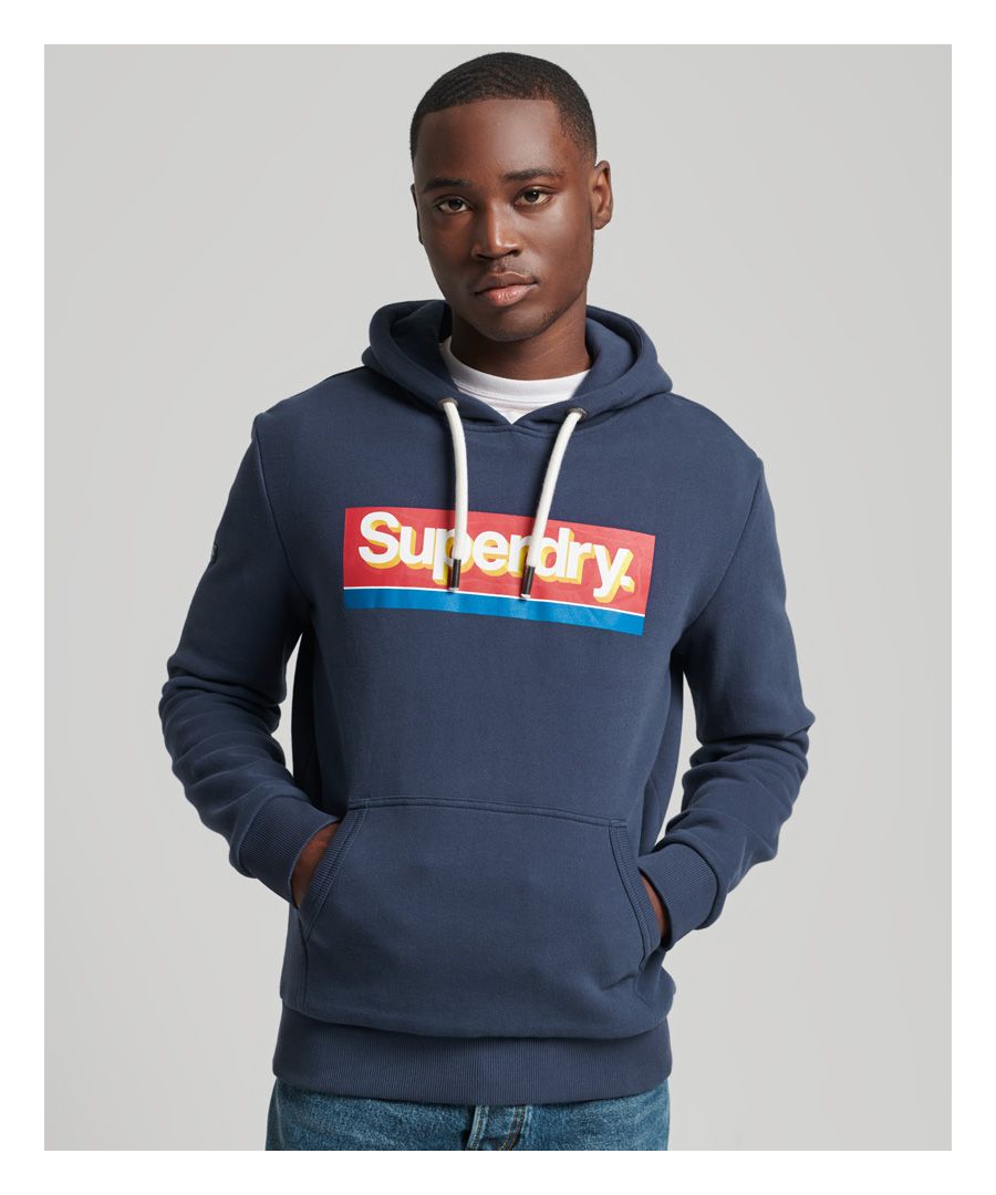 Something as classic as a simple hoodie is a great combination with a retro print. Nostalgic and familiar, the Vintage ore logo seasonal hoodie will add a retro style to your layering options.Relaxed fit – the classic Superdry fit. Not too slim, not too loose, just right. Go for your normal sizeDrawcord hoodLong sleevesRibbed trimsDistressed printed graphicFront pouch pocketSignature Superdry patch