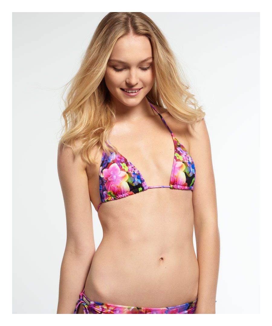 Superdry women's Fiji flower bikini top. \nA classic triangular bikini top featuring an all over floral print and spaghetti strap halterneck and back tie fastenings. The bikini is finished with branding on the straps and a metal Superdry logo badge. Model wears: Small Model height: 5’11” (181cm)