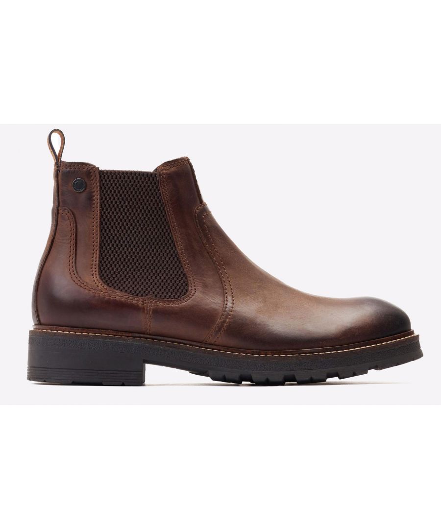 This stylish Chelsea boot is made from durable leather and features a strong nylon pull tab and elasticated gusset for easy access. Plus, the rubber sole is perfect for those cold weather walks.\n- Rear pull tab\n- Elastic Gusset\n- Base London branding stud on ankle