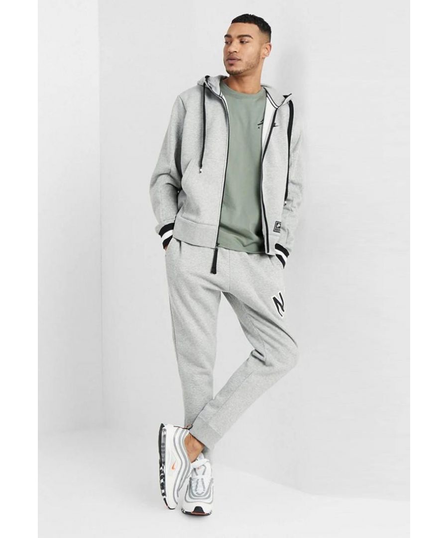 Nike Air Mens Zip Through Tracksuit Set in Grey.  \nDrawstring Hood, Zip Closure, Embroidered Swoosh.   \nPrinted Branding, Split Kangaroo Pouch Pocket.   \nWoven Brand Patch, Ribbed Cuffs & Hem.  \nElasticated Waist Band.   \nElasticated Drawstring Waist Joggers.   \nRibbed Bottom Leg Cuffs for Comfort Fit.