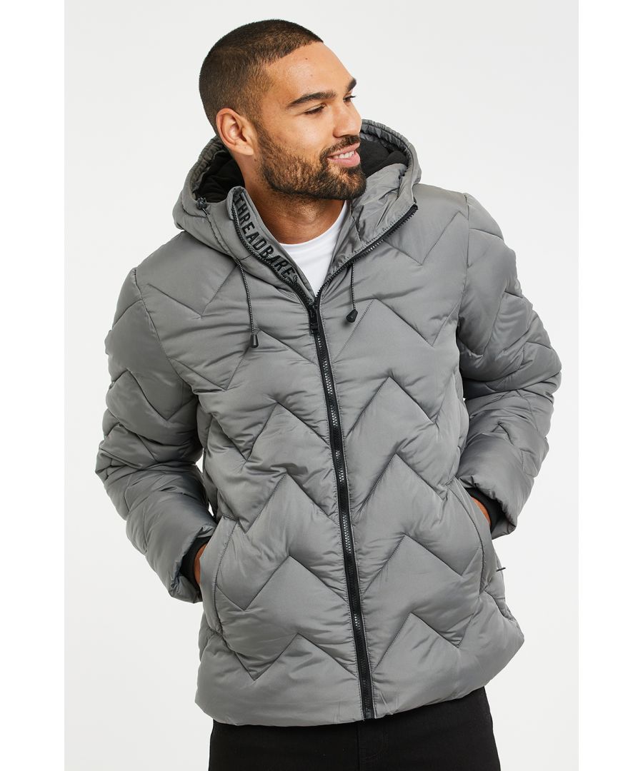 This hooded jacket with zig-zag design padding from Threadbare features two front pockets and an adjustable hood. It comes with ribbed cuffs and has the classic Threadbare logo on the sleeve. Other colours available.