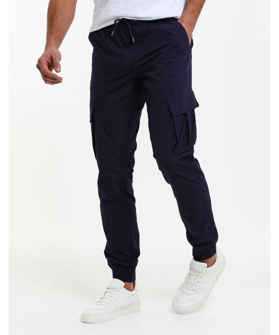 Freshen up your casual wardrobe with these slim fit, cuffed cargo trousers from Threadbare. They have an elasticated waist for comfort with fly fastening and drawcords. They feature four pockets and two cargo style pockets on the legs. Other colours available.