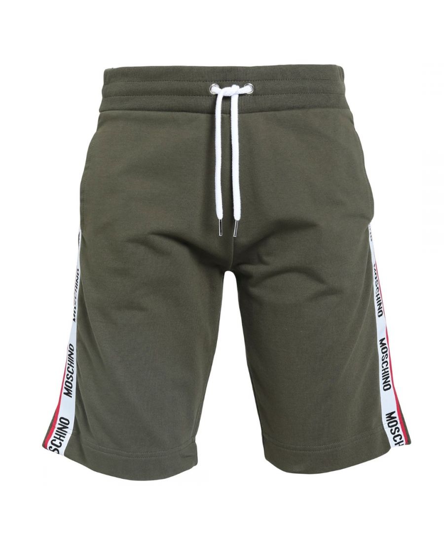 Moschino Branded Tape Logo Khaki Green Shorts. Moschino Green Shorts. Tape Logo Down Legs, Elasticated Waist. 95% Cotton, 5% Elastane, Back Pocket. Drawstring Ties, Moschino Loungewear Collection. Style Code: A4306 8102 0430